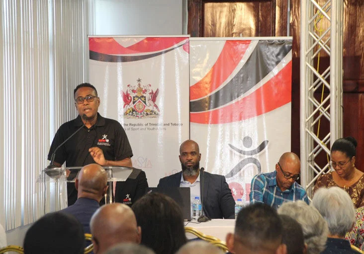 TALKING CHANGE: Minister of Sport and Youth Affairs Phillip Watts addresses representatives of over 50 National Governing Bodies during a forum held at Hasely Crawford Stadium on Saturday. (Image obtained at trinidadexpress.com)