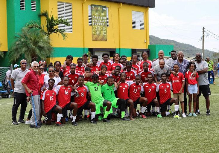 ALL TOGETHER: Trinidad and Tobago’s High Commissioner to Jamaica, former West Indies cricketer Deryck Murray, front left, poses with the players and staff of the national Under-17 team following the second and final match of their two-game friendly series against the Jamaica Under-17s at the Jamaica Football Federation (JFF) Technical Centre on The UWI Mona campus yesterday. Second from right, in the middle row, is JFF president Michael Ricketts.  —Photo: TTFA Media (Image obtained at trinidadexpress.com)